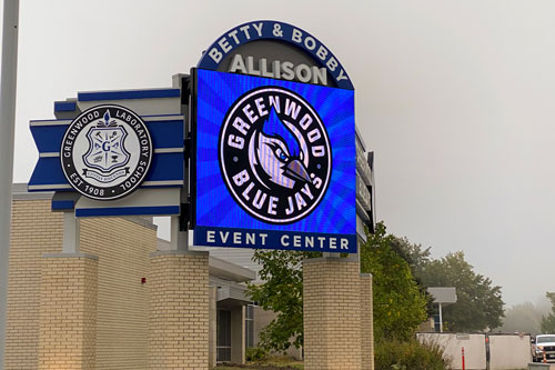 large LED display on overhang at school's event center