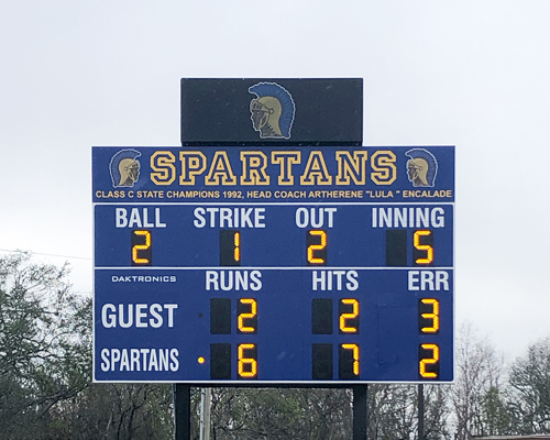 speaker with school logo above scoreboard