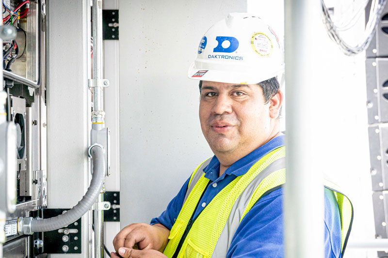 field service worker adjusting electrical wiring