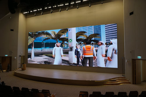 Video wall behind stage in auditorium